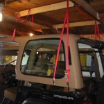 Top hanging above Jeep, from rear