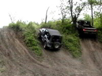 The Taylors climb the medium hill while a Chevy is high-centered on the hard hill